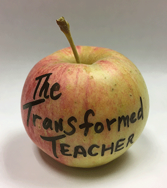 Apple with Transformed Teacher written on it