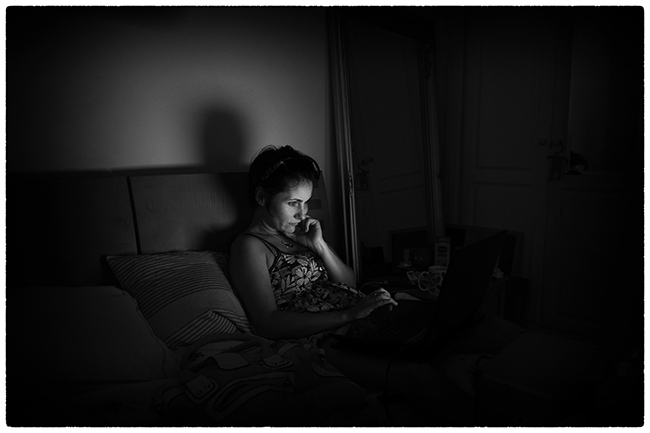 Woman sitting on couch thinking